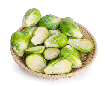 High angle view of vegetables in basket on white background