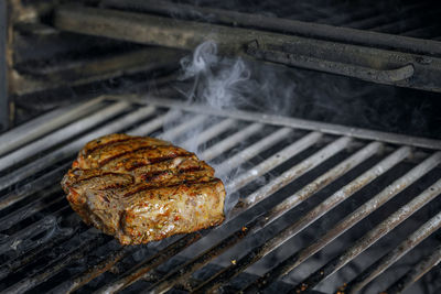 Close-up of meat on barbecue grill