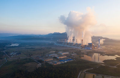 High angle view of smoke emitting from factory against sky. coal power plant.