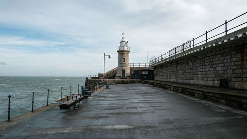 View of lighthouse against cloudy sky