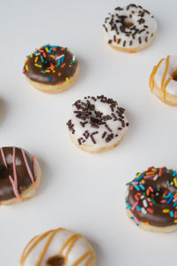 Directly above shot of donuts on white background