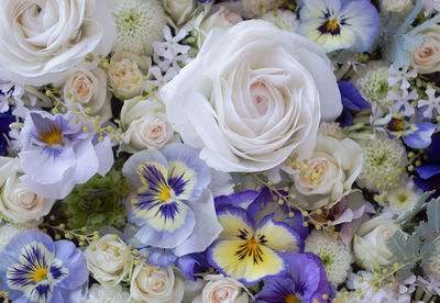 Flower arrangement of violas and roses