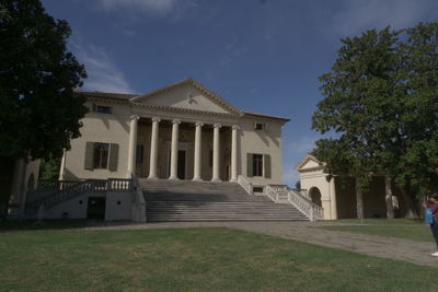 Facade of historic building against sky