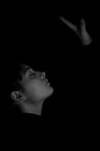 Boy on black background