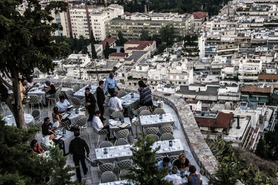 High angle view of people at outdoor restaurant in city