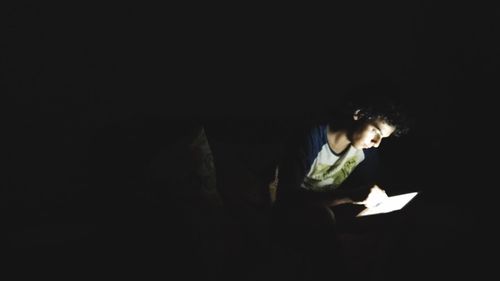 Man sitting on book