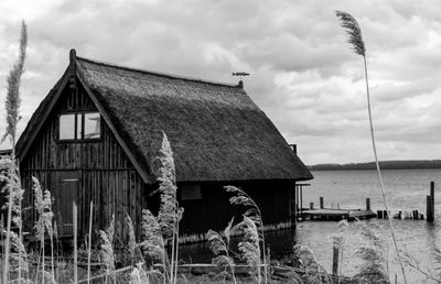 House by building against sky