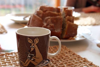 Close-up of coffee cup on table