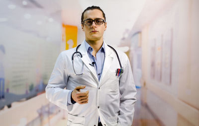 Portrait of male doctor standing in hospital