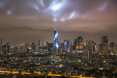 Illuminated buildings in city at night