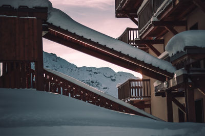 Low angle view of building against sky during winter