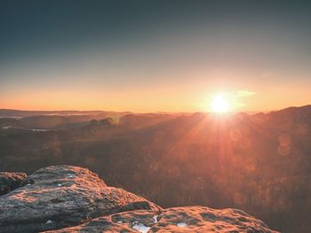 Scenic view of mountains against sky during sunset