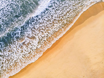 Close-up of surf on beach