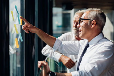 Side view of a young man smoking