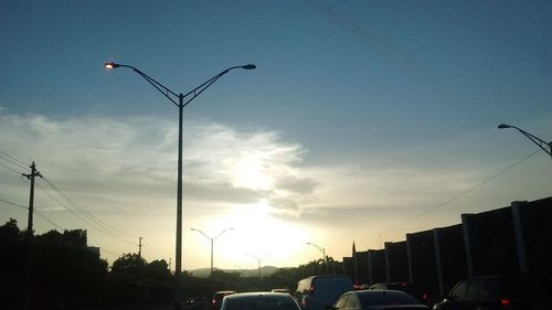 Low angle view of buildings against sky at sunset