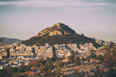 Buildings in city against sky