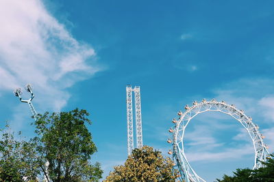 Low angle view of ferris wheel against sky