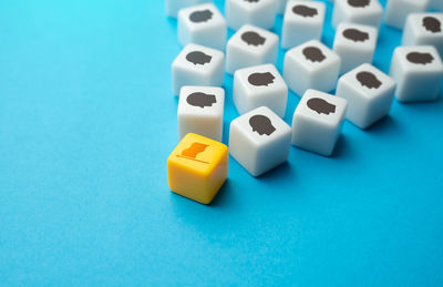 Close-up of dices on blue background