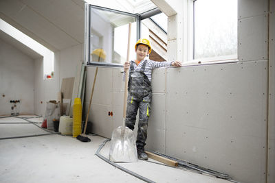 Portrait of young woman standing in bathroom