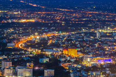 High angle view of illuminated buildings at night