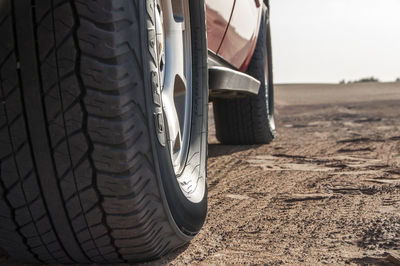 Close-up of black car on road