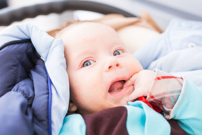 Close-up of cute baby boy sleeping on bed at home