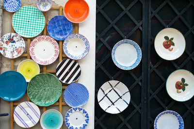 High angle view of multi colored plates on table