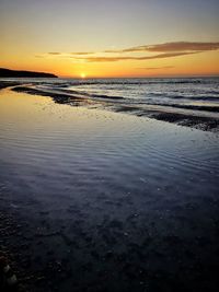 Scenic view of beach during sunset