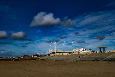 Scenic view of beach against blue sky