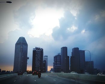 City skyline against cloudy sky