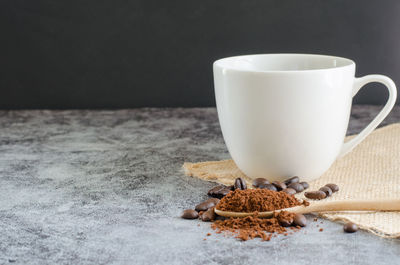 Close-up of coffee cup on table