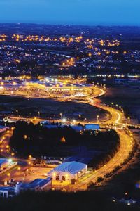 Aerial view of illuminated cityscape at night