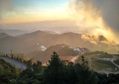 Scenic view of mountains against sky during sunset