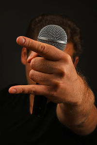 Close-up of guitar against black background