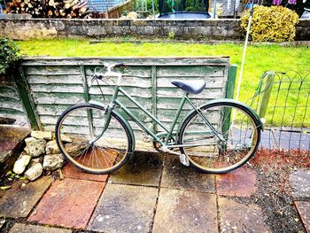 Bicycle parked against wall