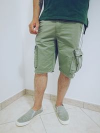 Low section of man standing on floor