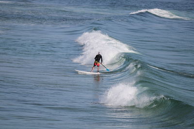 Man surfing in sea