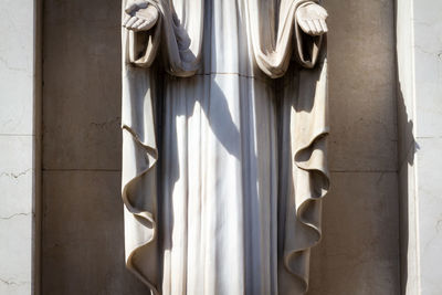 Low angle view of sculpture on wall of building