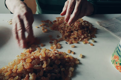 High angle view of person preparing food on table