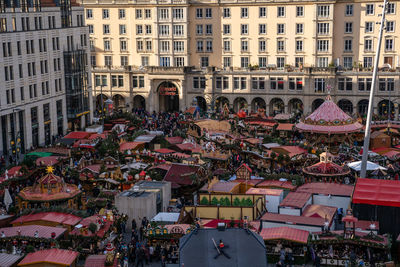 High angle view of people in city against buildings