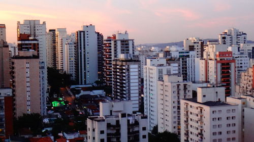 Cityscape against sky during sunset