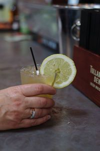 Close-up of hand holding drink