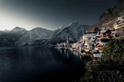 Panoramic view of lake and buildings against sky