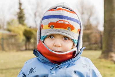 Close-up portrait of toddler girl wearing warm clothing during winter