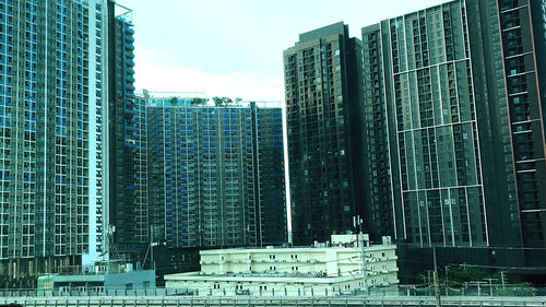 Low angle view of modern buildings against sky