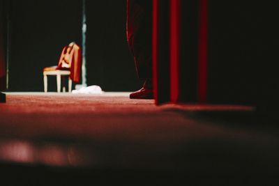 Low section of artist standing on illuminated stage