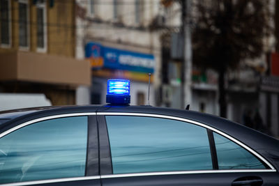 Illuminated light on car in city