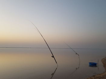 Fishing rod on calm lake