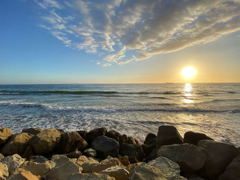 Scenic view of sea against sky during sunset