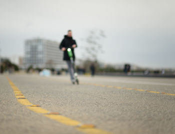 Man riding motorcycle on road